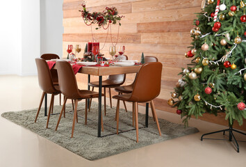 Festive dining table with Christmas setting and beads in room