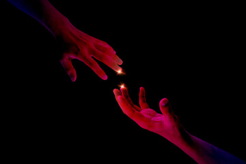 Hands neon duotone colorful of reaching out, giving a helping, hope and support each other on dark background. Solidarity, compassion and charity concept. - obrazy, fototapety, plakaty