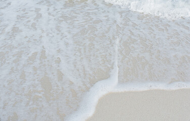 Soft wave of ocean on sandy beach. Summer vacation in island. clear azure water Background.