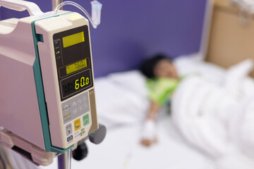 Child's hand fever patients have IV tube in hospital. Toddler girl wearing IV tube sleep in icu emergency bed room for leukemia coma from Cancer, Pediatric, Dengue fever. Sick children, infected.
