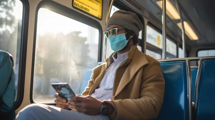 Fotobehang Man wearing face mask in public transport © ladaz