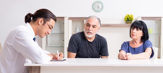 Financial advisor giving retirement advice to old couple