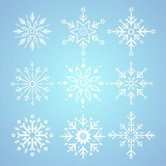 Group of white snowflakes for winter, spring and Christmas elements on isolated blue background, white geometric minimalist snowflake elements and icons concept design