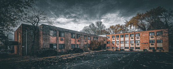 Abandoned apartment complex in the fall right before a storm