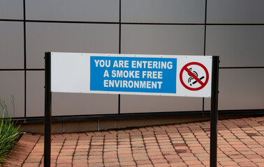 outdoors sign, no smoking,  you are entering a smoke free environment