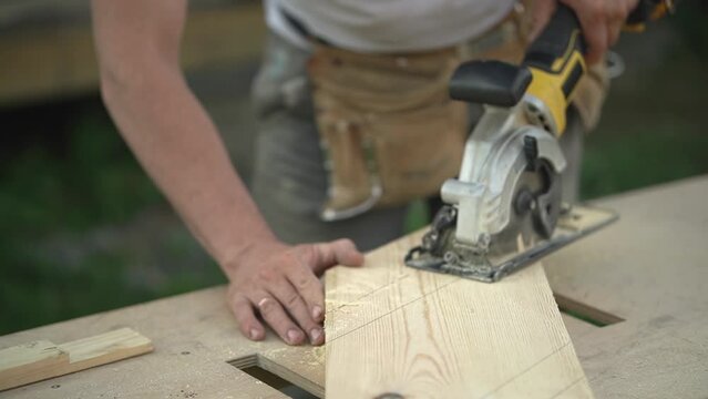 wood processing. builder uses power tools. Slow motion video. High quality video in FullHD format.