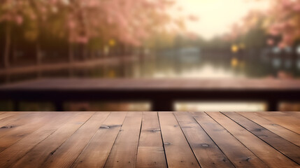Empty wooden board table in front of blurred cherry blossom bloomed in spring season background