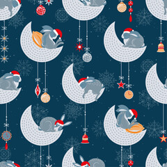 New Year's Hares in red caps sleep on the moons. Night sky, Christmas toys, snowflakes. Seamless vector pattern.