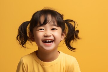 Fashion smiling mother holding her kid on solid color background, love concept