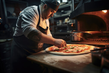 A chef is making pizza - obrazy, fototapety, plakaty