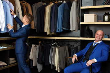 An adult beautiful gay couple is relaxing and shopping. Two handsome men.