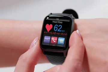 Fotobehang Smart wearable watch showing heartbeat © Andrey Popov