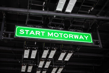 Start motorway green sign in interchange transport tunnel entrance traffic direct