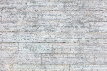 Wall made of concrete bricks as an abstract background. Texture