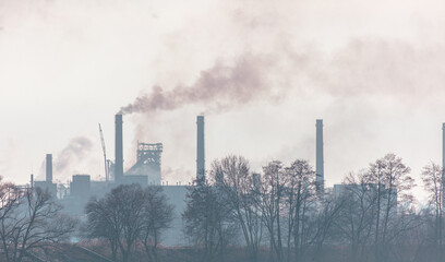 Smoke from the chimneys of a metallurgical plant in nature