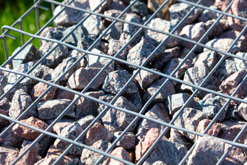 Stones under a metal grate. Background