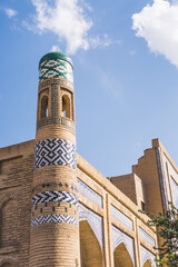 Madrasah of Muhammad Amin Khan in Khorezm is lined with blue tiles, an ancient minaret