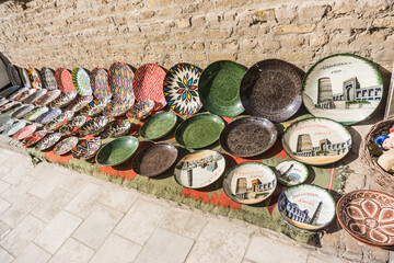Painted plates in Asian style with patterns and ornaments, handmade