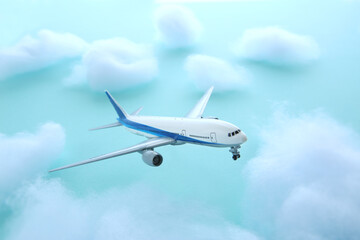Fototapeta na wymiar 青空を飛ぶ飛行機と雲