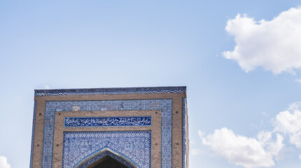 Facade of the Madrasah of Muhammad Amin Khan with cladding and mosaics in Khorezm
