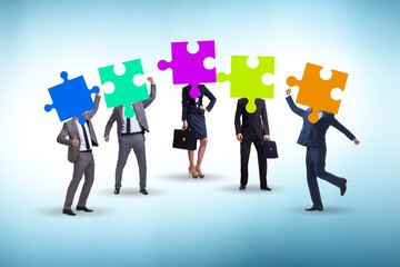 Concept of business people and jigsaw puzzle