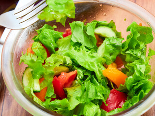 Vegetable salad with tomatoes, cucumbers and herbs.