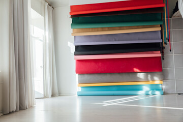 Lots of paper colorful backgrounds in white photo studio