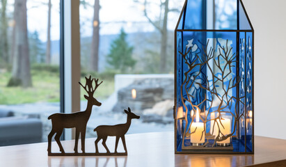 Glass lantern decorated with two deer.