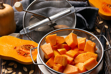 pumpkin on wooden table prepared for cooking - 680014730
