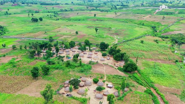 Traditional village in central Nigeria with grass huts - push forward aerial