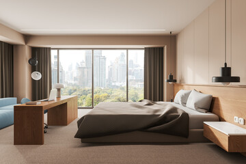 Fototapeta na wymiar Stylish home bedroom interior with workplace, bed and sofa near window