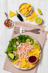 shrimps with lettuce, corn chips, chili sauce