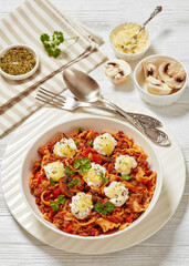 Lasagnette with ground beef in bowl, top view