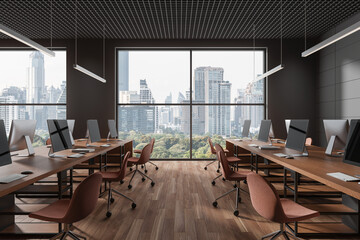 Grey coworking interior with chairs, pc computers and desk in row near window