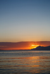 Sun goes down over the horizon in Croatia. Beautiful sunset landscape on Adriatic sea coast