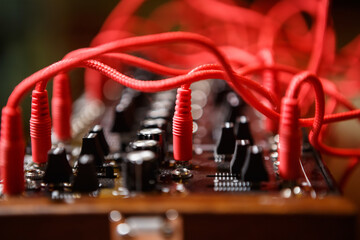 Audio cables connecting synthesizer board in a sound recording studio