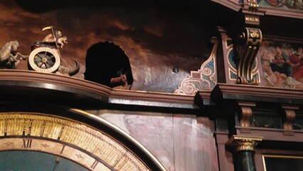 close up on detailed decorations on astronomical Clock inside Notre Dame cathedral Strasbourg.