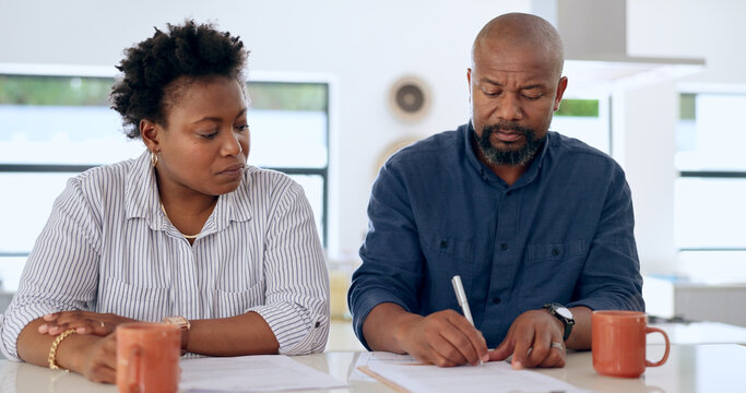 Couple, married and signature with document in home for paperwork, contract or legal agreement. Black woman, man and worry for future, finances and savings by cover in safety in security for divorce