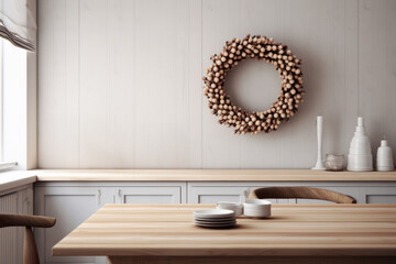 Modern kitchen interior in earthy beige colours with Christmas wooden beads wreath decoration hanging on light wall. Scandinavian nordic concept