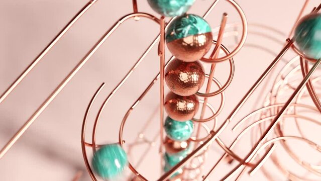 Artistic steel track marble run machine on plain background. Satisfying Copper rail rolling ball sculpture. 3d animation