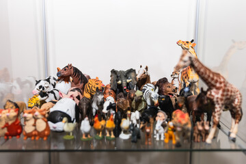 Front view of a showcase with toy animals in a therapy session. Play Therapy Concept