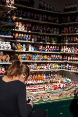 Folkloric Festivity: Santa Llucia Christmas Market Stall Overflowing with Caganer Figures in Barcelona