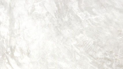 The light-colored cement wall has cracks.