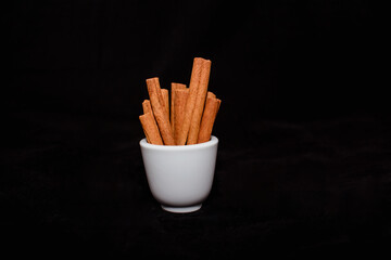 Delicious fresh cinnamon sticks on a beautiful background