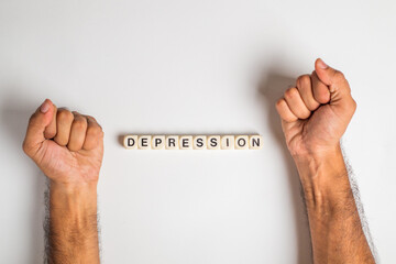 depression gesture with close fists and word depression written with dice isolated on white...