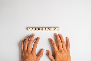 depression gesture with hand gesture of stress and word depression written with dice isolated on...