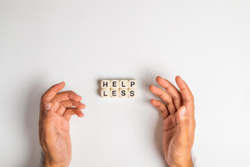 help less man writes word help less with dice, isolated on white background feeling depressed