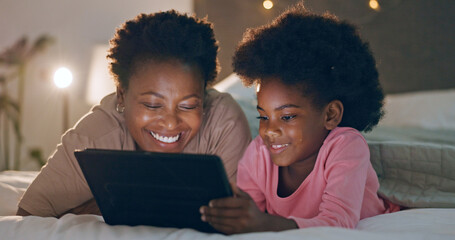 Mom, child and tablet in bedroom, watching cartoons and night time in bed, technology and laugh. Happy, enjoying and online for videos, digital and internet in home, streaming or bonding together - obrazy, fototapety, plakaty