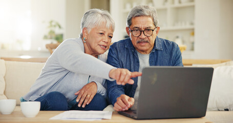 Senior, couple and planning on laptop in living room with document for finances, investment or retirement. Elderly man, woman and pointing by technology for online banking, account balance or savings - Powered by Adobe