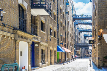 Street view of Shad Thames, a historic riverside street next to Tower Bridge in London